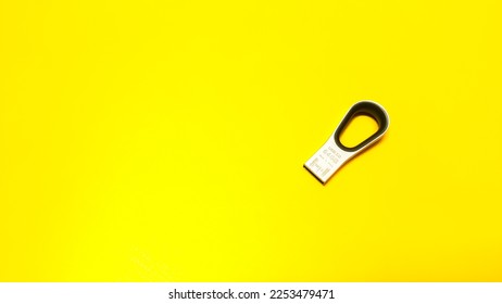 USB flash memory or USB stick isolated on yellow background. USB flashdisk.