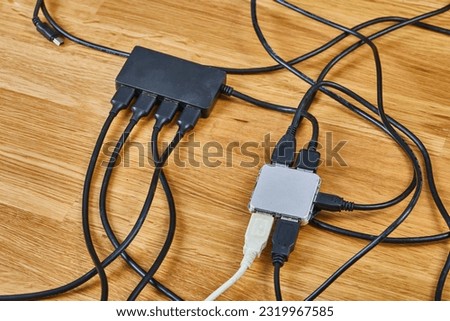 USB hubs connected to each other with many cables and devices