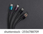 USB type A, USB type C cable isolated on dark background.