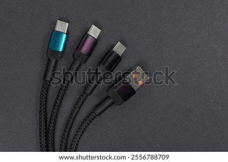 USB type A, USB type C cable isolated on dark background.