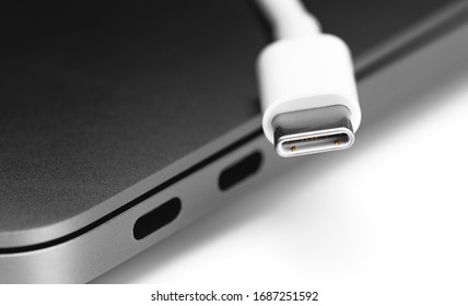 USB Type-C cable with notebook USB C ports closeup 