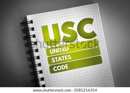 USC - United States Code is the codification by subject matter of the general and permanent laws of the United States, acronym text on notepad
