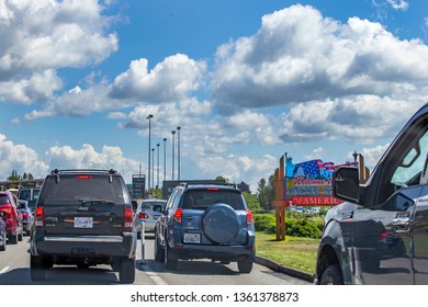 US/Canada Border, Peace Arch, Washington State, USA - September 20, 2018: Busy Border Crossing Between US And Canada.  