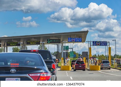 US/Canada Border, Peace Arch, Washington State, USA - September 20, 2018: Busy Border Crossing Between US And Canada.  