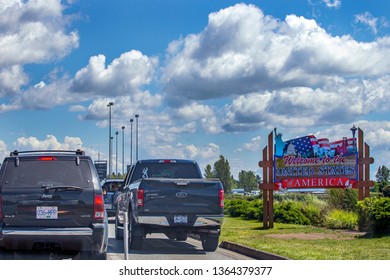 US/Canada Border, Peace Arch, Washington State, USA - September 20, 2018: Busy Border Crossing Between US And Canada.  