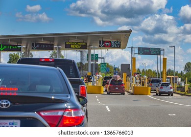 US/Canada Border, Peace Arch, Washington State, USA - September 20, 2018: Busy Border Crossing Between US And Canada.  