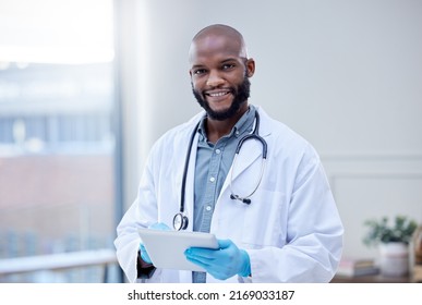 Use The App To Make An Appointment. Shot Of A Male Doctor Using A Digital Tablet.