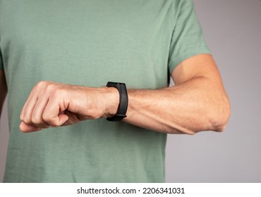 Use Black Smart Fitness Watch, Bracelet On Male Hand. High Quality Photo