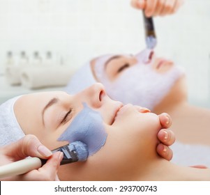 Use Of A Face Mask To The Face Two Young Women In A Beauty Salon