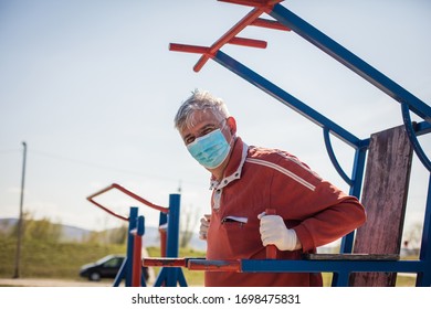  Use The Good Time To Exercise. Senior Man With Mask On Face Working Exercise Outdoors.