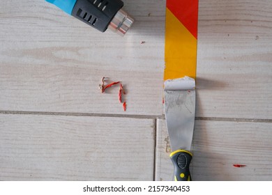 Use Of Heat Gun And Spatula To Remove Marking Tape From Floor