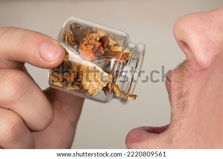 use of large doses of dried red fly agaric, man eat amanita muscaria.