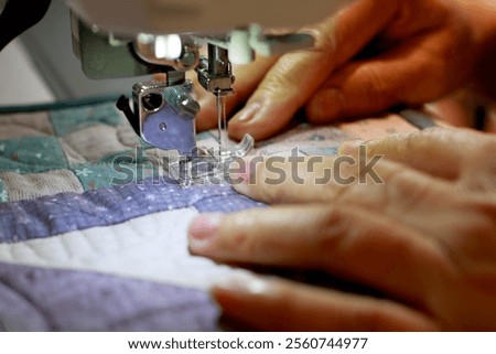 Use sewing machine create handmade patchwork quilt