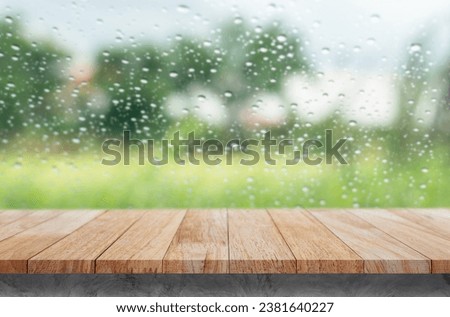 Use this wood tabletop with raindrops on a clear pane to showcase or montage your products.