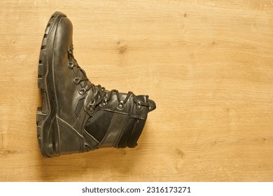  Used black leather military boots                               - Powered by Shutterstock