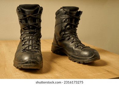  Used black leather military boots                               - Powered by Shutterstock