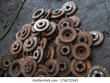 Used Brake Rotor And Car Part At Junkyard Or Scrapyard For Recycling