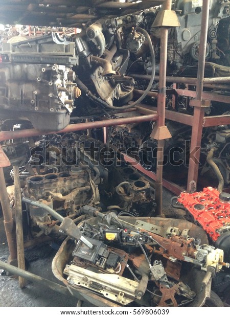 used and broken car engines at car workshop.
selective focus applied