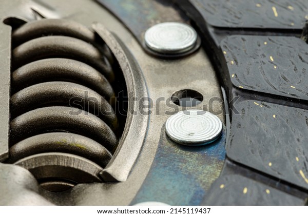 Used car clutch with damper springs and\
friction linings, isolated on a white\
background.