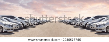 Lot of used car for sales in stock with sky and clouds