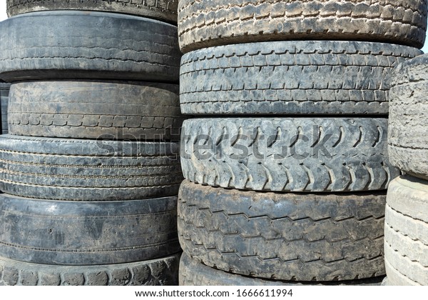 Used car tires, stacked on top of each other.\
Seasonal tire change.