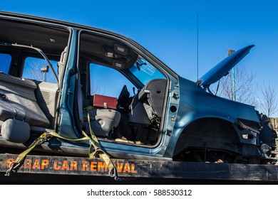 Used Car Transported To Car Recycle Facility Via Flat Deck Truck By Scrap Car Removal Company.