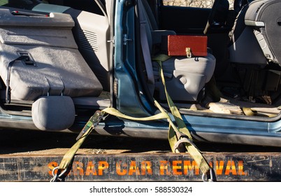 Used Car Transported To Car Recycle Facility Via Flat Deck Truck By Scrap Car Removal Company.