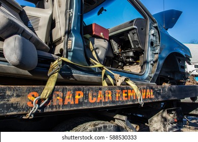 Used Car Transported To Car Recycle Facility Via Flat Deck Truck By Scrap Car Removal Company.