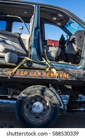 Used Car Transported To Car Recycle Facility Via Flat Deck Truck By Scrap Car Removal Company.