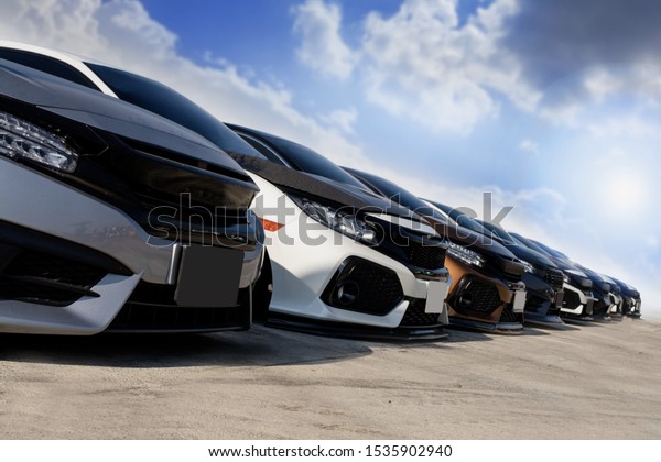 Used\
cars, parked in the parking lot of Dealership waiting to be sold\
and delivered to customers and waiting for the auction with the\
trading concept and auction in Automotive\
Industry