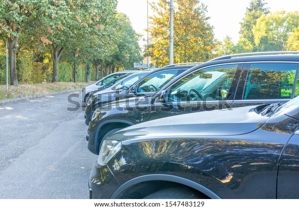 Used cars in a\
parking lot at the car\
dealer