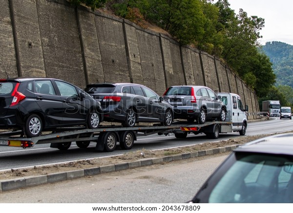 Used cars\
transported on a car platform to the new owners. Car transport -\
concept. Romania, Orsova. September, 17,\
2021