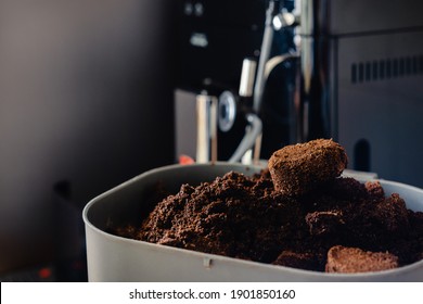 Used coffee grounds from espresso machine. Recycling compost container filled with used coffee waste. Coffee machine cleaning. - Shutterstock ID 1901850160