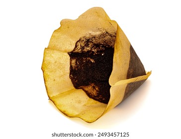 Used cone coffee filter on white