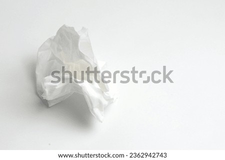 Used crumpled paper tissues on white background.