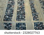 Used damaged cars on auction reseller company big parking lot ready for resale services. Sales of secondhand vehicles for rebuilt or salvage title