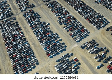 Used damaged cars on auction reseller company big parking lot ready for resale services. Sales of secondhand vehicles for rebuilt or salvage title - Shutterstock ID 2275384681