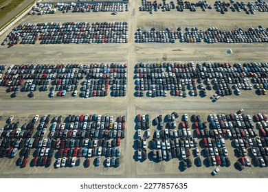 Used damaged cars on auction reseller company big parking lot ready for resale services. Sales of secondhand vehicles for rebuilt or salvage title - Shutterstock ID 2277857635