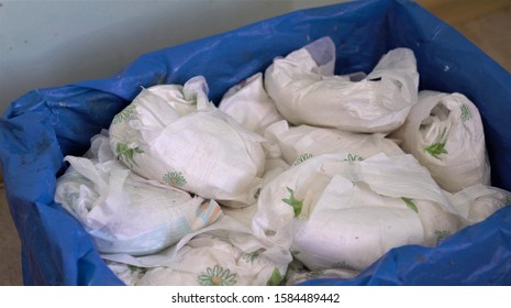 Used Dirty Diaper In The Trash Bin. Disposable Nappies 