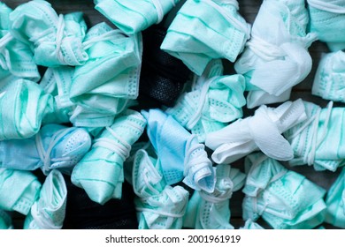 Used disposable hygienic masks on the floor. Infectious waste, prevented virus covid-19 by separating infected waste. Used protective masks for utilize, healthy and medical concept - Shutterstock ID 2001961919