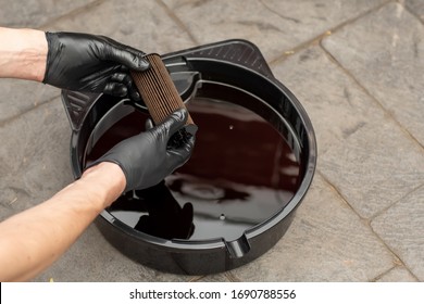 Used Drained Motor Oil In A Black Tray And Used Oil Filter. DIY Change Engine Motor Oil. Disposing Of Old Oil