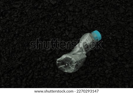 Used drinkingwater botle with dark background 