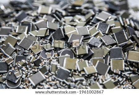 used and used electrical capacitors and mounting elements, top view. Background of capacitors