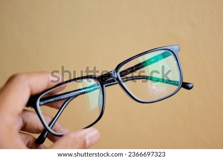 used glasses The image is sharp and close. It is a good background suitable for using blue glasses. Work concepts and eye health