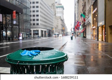 Used Glove On Empty Street Of New York City During Coronavirus Quarantine Lockdown