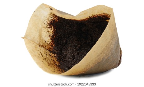 Used ground coffee in a filter isolated on white background, side view.