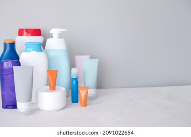 Used Hygiene Products On A Gray Background. Trash With Used Cosmetics Plastic Packaging. Conscious Consumerism. High Quality Photo