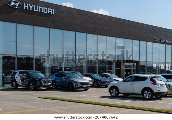 Used Hyundai cars are parked near Hyundai car\
dealership in Mega Adygea. On facade of building of car dealership\
inscription and logo of car manufacturer Hyundai. Krasnodar, Russia\
- August 17, 2021