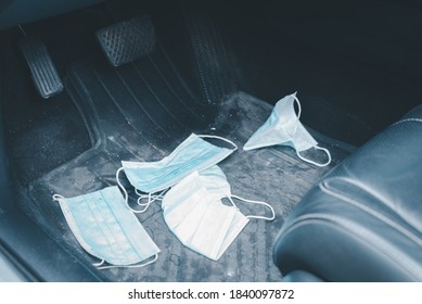 Used Medical Face Mask Was Left Under The Driver's Seat In The Car That Accumulated For Many Days Waiting For Disposing Of Properly. Good Hygiene Concept In Covid-19 Situation Period.