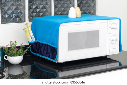 The Used Microwave Oven With The Cover Blanket To Protect Dust Or Dirty